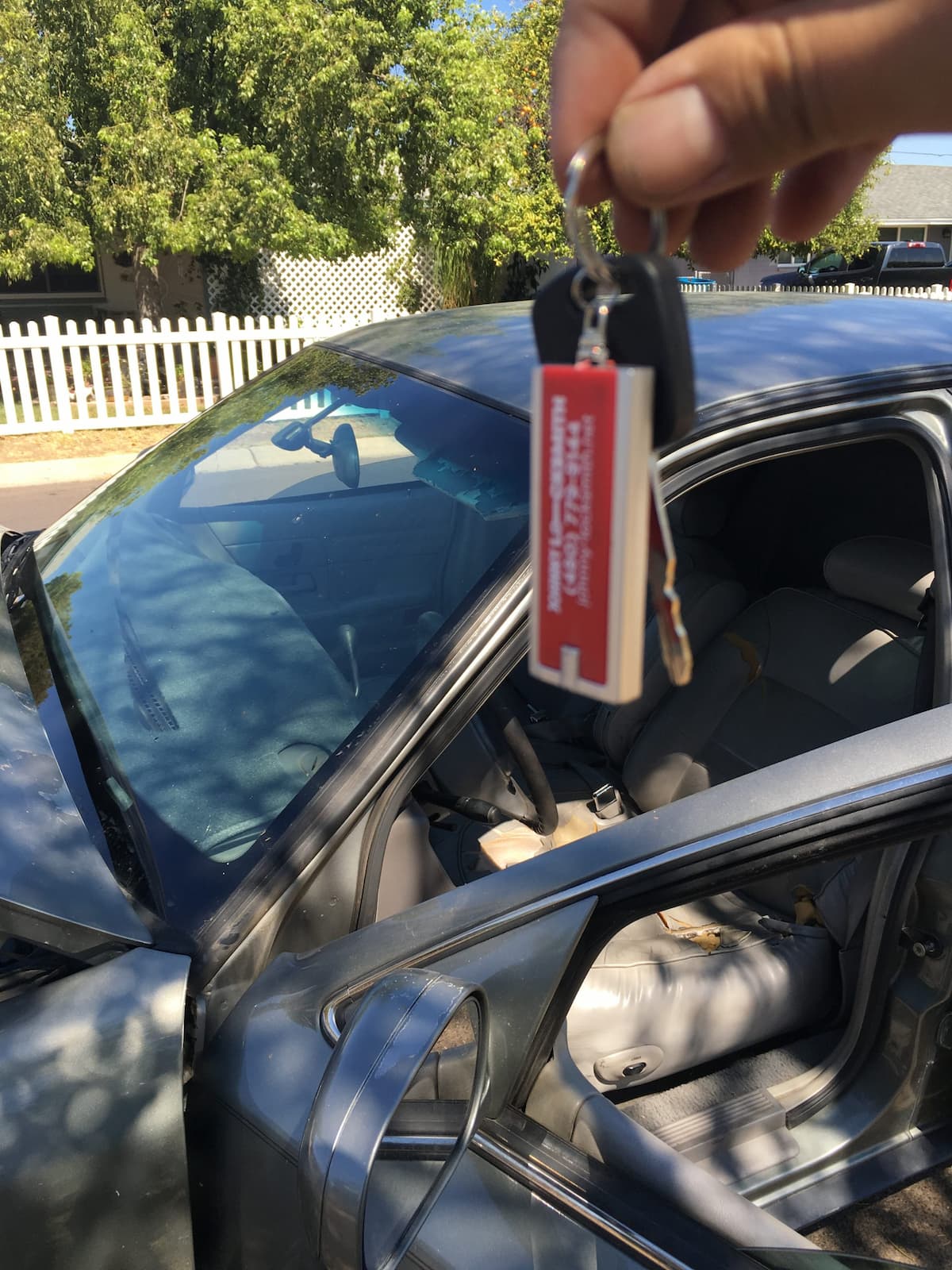 Johnny Locksmith of Phoenix opening a locked car door on site
